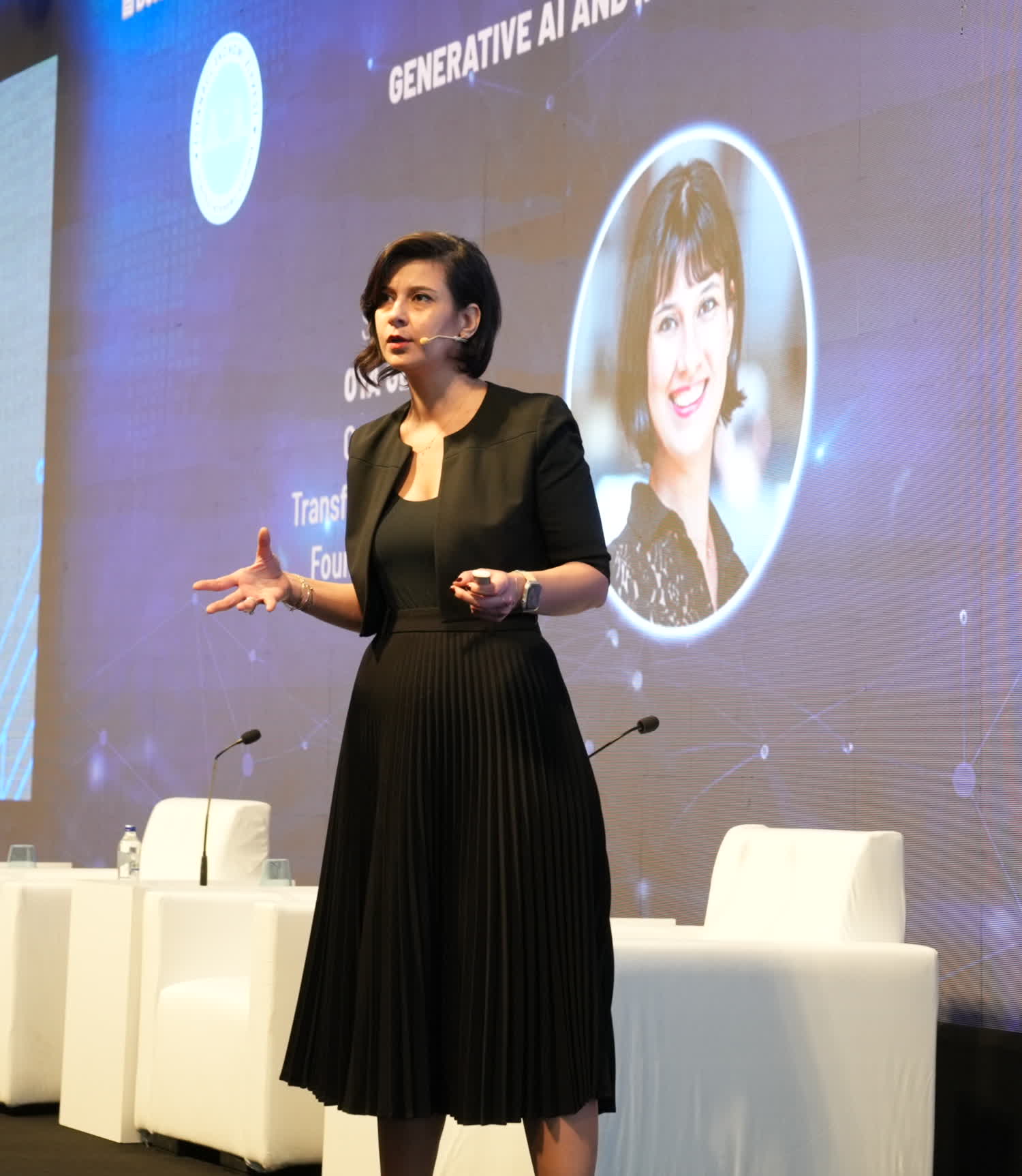 Oya Geron speaking on stage